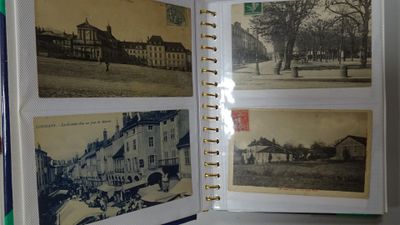 an open book with pictures of buildings on it