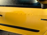 a close up of a car door handle with a sticker on it