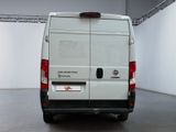 a white van that is parked inside of a building