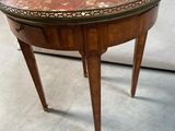 an image of a small table with a marble top and legs