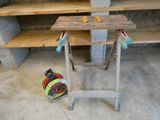 a workbench with tools on top of it in a garage
