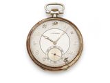 a silver pocket watch with roman numerals on the face