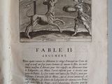 an old book with a picture of a man and a dog on it
