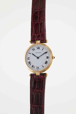 a close up of a wrist watch with roman numerals on it