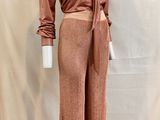 an image of a mannequin wearing a brown shirt and pants