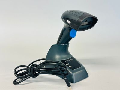 a blue and black handheld barcode scanner on a white surface
