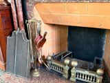 a fire place with a bunch of items on the mantle