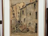 aquarelle encadrée représentant une scène de rue dans un vieux village européen