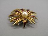yellow and red flower brooch with pearl in center