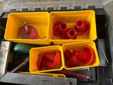 four yellow containers with tools in them on the floor