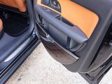a close up of a car door with the driver ' s seat up