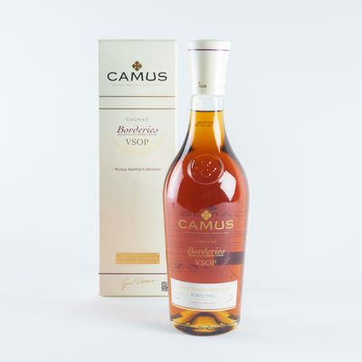 an image of a bottle of camus brandy next to a box