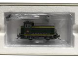 une image représentant une locomotive verte et jaune dans un cadre blanc