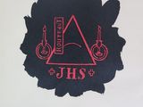 a black and red logo on a white wall