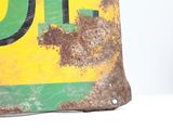 a rusted metal sign with the number 10 on it