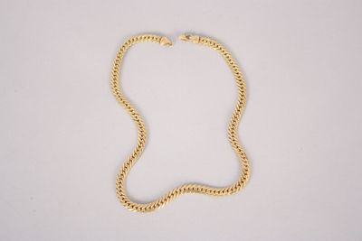a gold chain necklace with a clasp on a white background