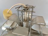 a metal rack with a bunch of plates and cups on it