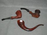 two pipe holders that are sitting on a table