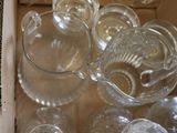 a lot of glass items in a box on the table