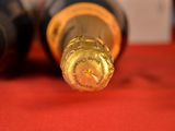 a close up of a bottle of wine on a table