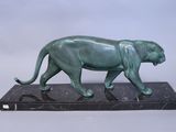 statue of a panther on a marble base on a white background