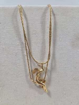 Charles Jourdan : collier pendentif danseuse.