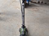an image of a machine that is on the ground in a garage