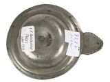 a silver plate with a tag on it