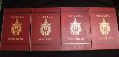 four books of different styles and designs on a black surface