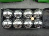a box of boccup balls and a bag of balls