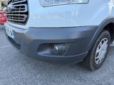 a white van that is parked in a parking lot