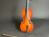 a violin that is sitting next to a violin
