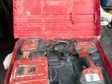 a red tool box with tools in it sitting on a table