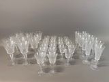 a lot of wine glasses sitting on a table