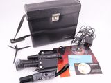 a black briefcase with a camera and other items on it