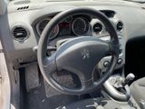 a dashboard of a car with a steering wheel and dashboard buttons