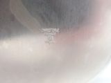 a close up view of a silver vase with a cross on it