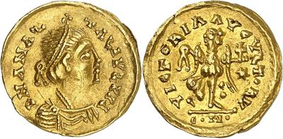 a gold coin with an image of a man on it