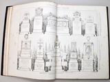 an open book with a drawing of a bunch of tombstones