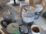 many barrels and buckets on the floor in the room