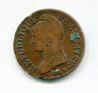 a close up of a coin on a white surface