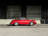 an image of a red car parked in front of a building