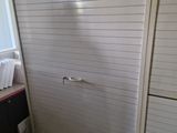 a bathroom with a toilet and a shower stall in it