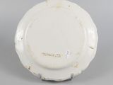 underside view of a white plate with a black border