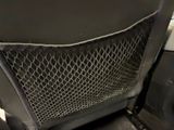 a car seat that has a mesh net on the back of it
