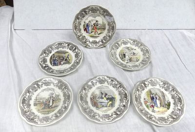 six plates with different designs on them sitting on a table