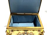 a gold and blue box with a blue lid
