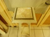 a small table that has a tile top on it