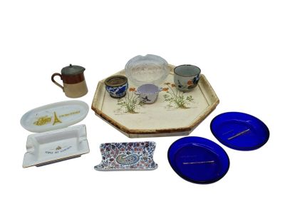 a tray with a tray, cups, plates, and a tray with a candle