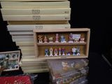 a lot of christmas figurines on display on a table
